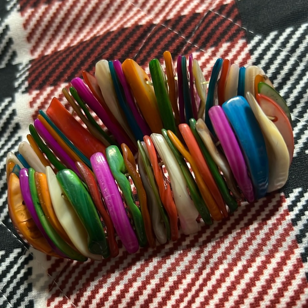 Woman’s multicolored bracelet.